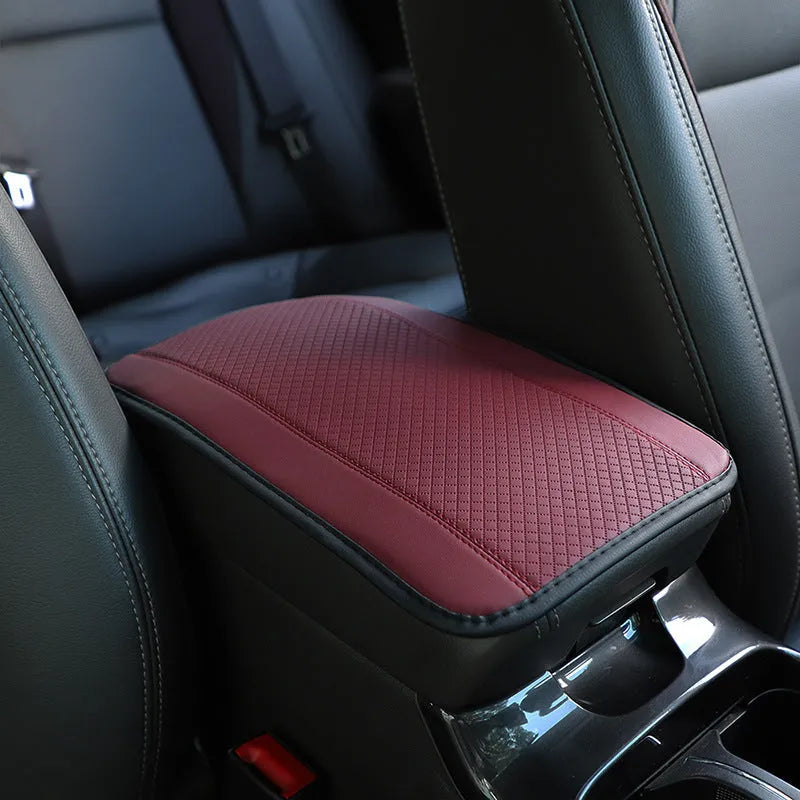 Black PU leather car armrest box cushion mat measuring 32 by 19 centimetres.
