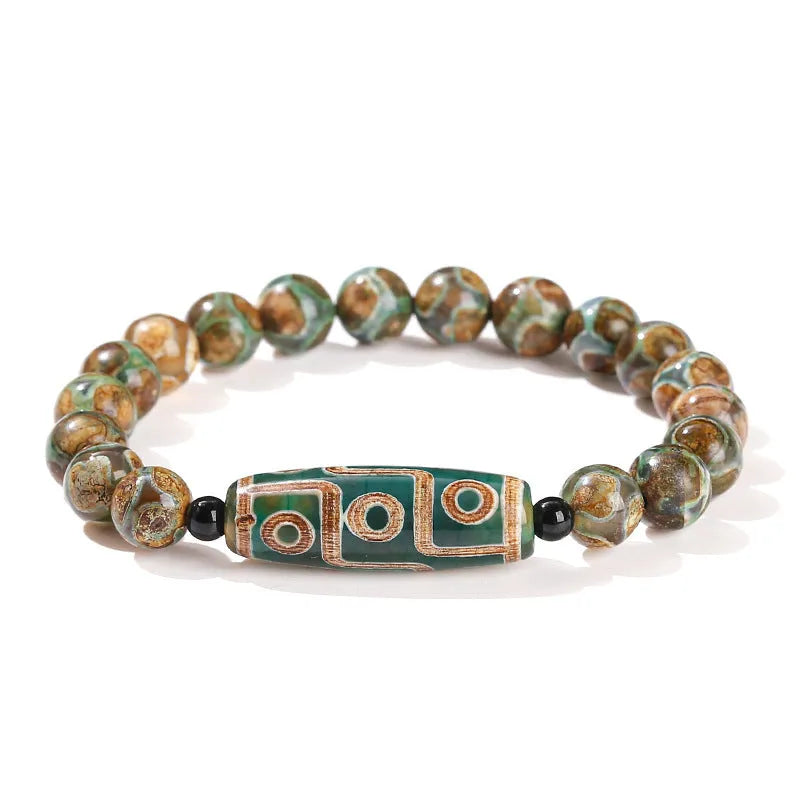 Green Dzi bead barrel shaped bracelet with 8mm handmade beads and Tibetan-inspired design