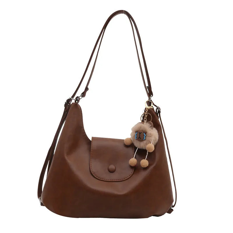 Women's leather shoulder bag in horizontal square shape with single strap