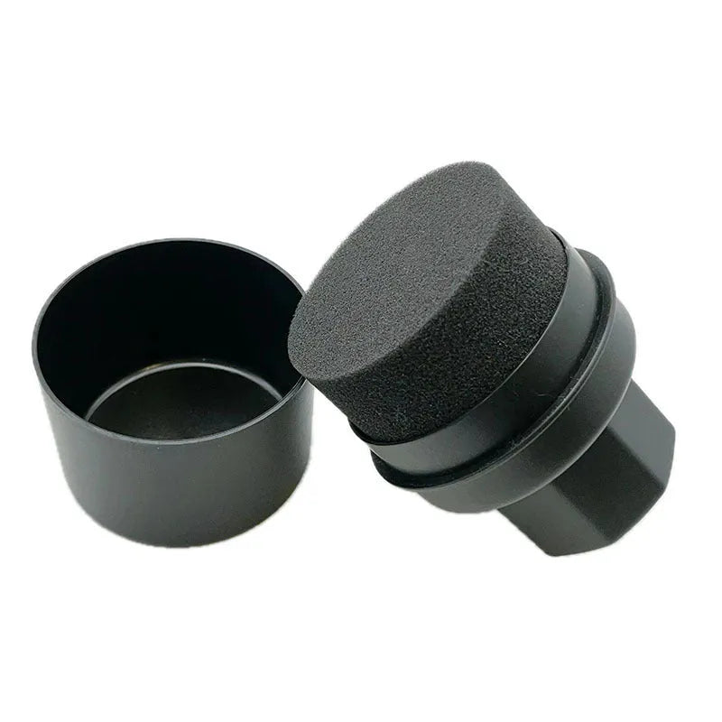 Black car tyre polishing sponge brush with lid on a clean tyre, showing ergonomic PP handle and applicator head.