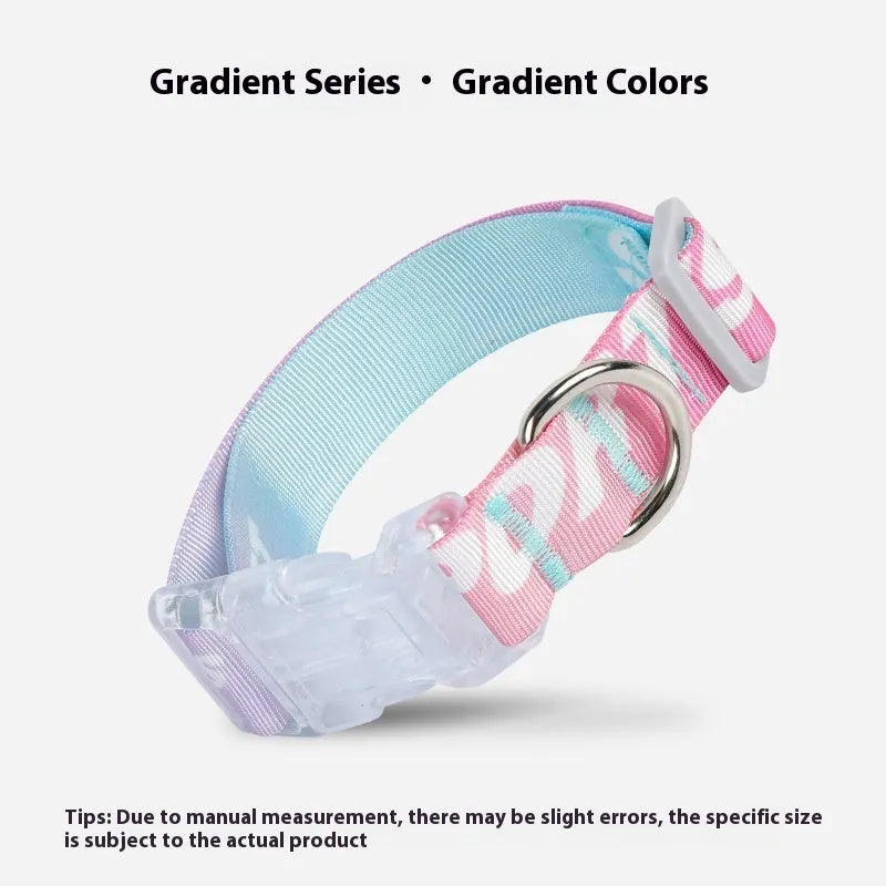 Adjustable nylon dog collar with vibrant cartoon gradient print and metal D-ring on a green background.