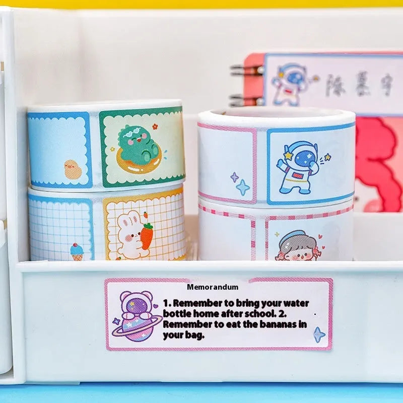 Roll of colourful cartoon name tape stickers with dinosaur and astronaut designs for labelling.