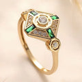 Square geometric ins-style women's ring with lvzuan coloured stones on a model's hand.