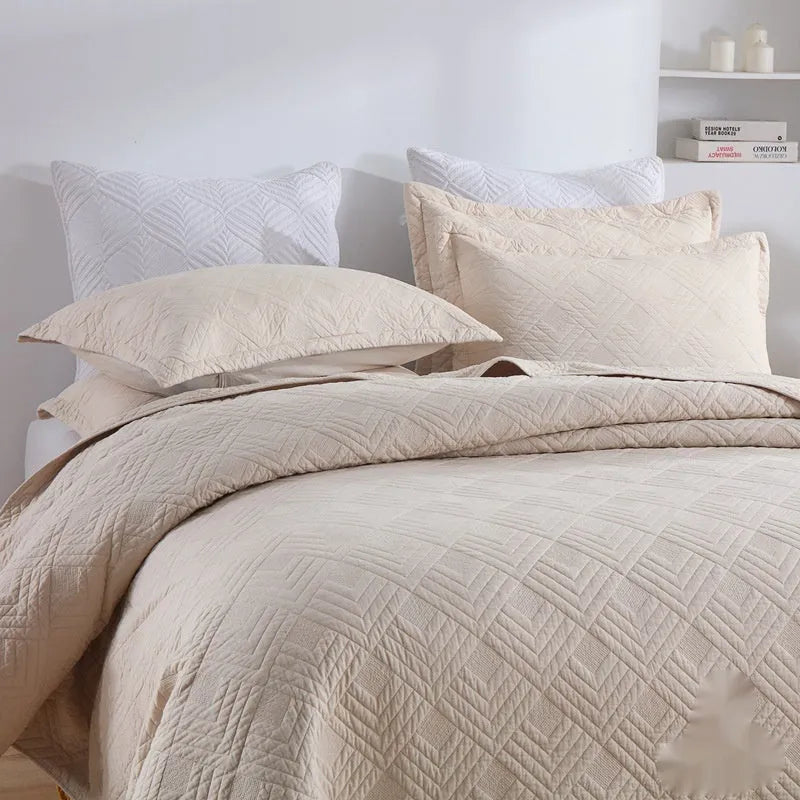 Double-sided pure cotton bed cover three-piece set in a light grey damascus pattern on a bed.