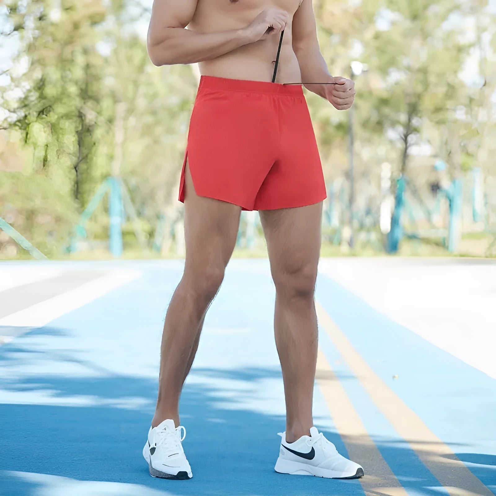 Men's black high-waist running shorts with loose fit and nylon lining for off-road and marathon running.