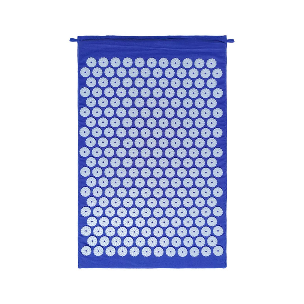 Black and blue acupuncture massage mat with cushion and headrest on floor