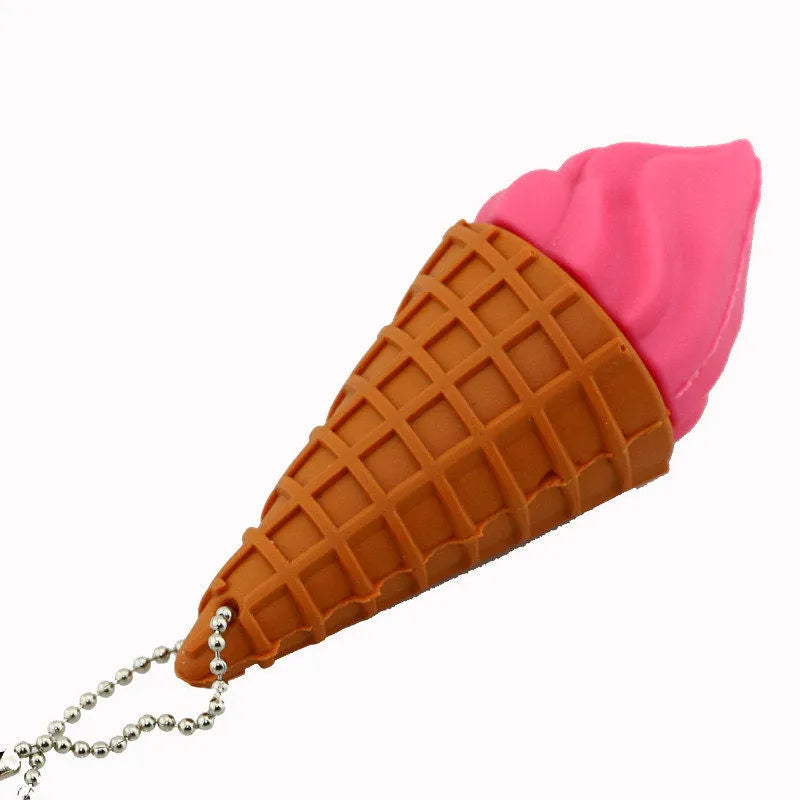 Miniature pink ice cream cone shaped USB flash drive on a white background.