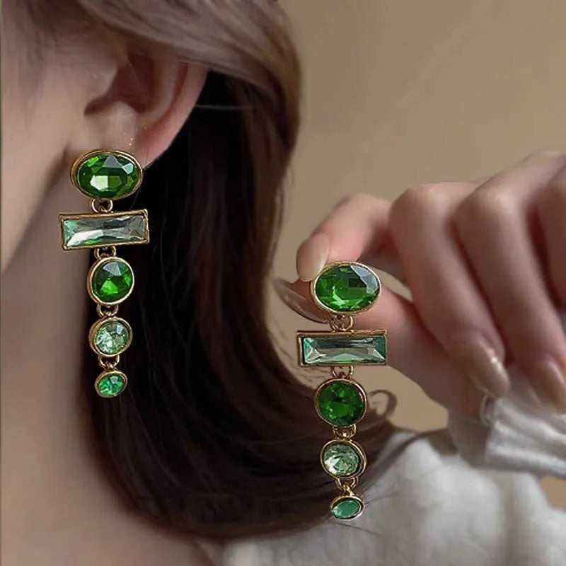 Pair of green gradient geometric alloy earrings with a tassel and inlaid zircon stone details on a white background.