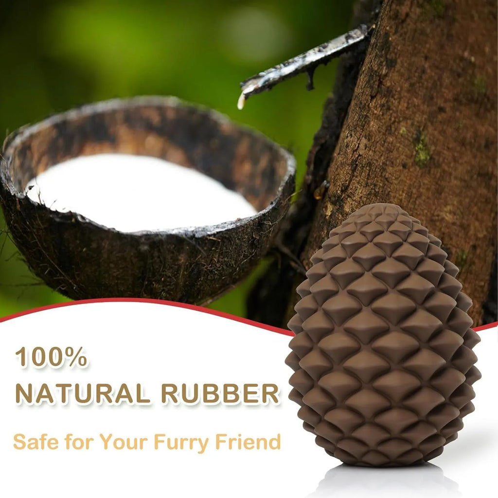 Yellow pine cone-shaped natural rubber dog chew toy with treat dispenser hole.