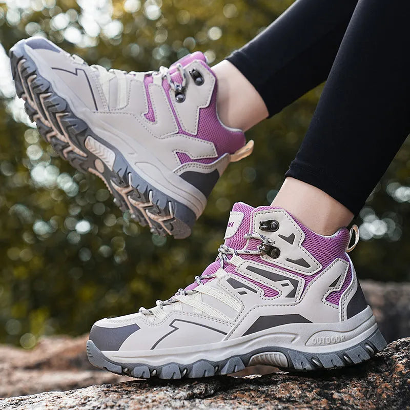 Men's and women's flannel hiking sneakers in various colours on a rocky outdoor path.