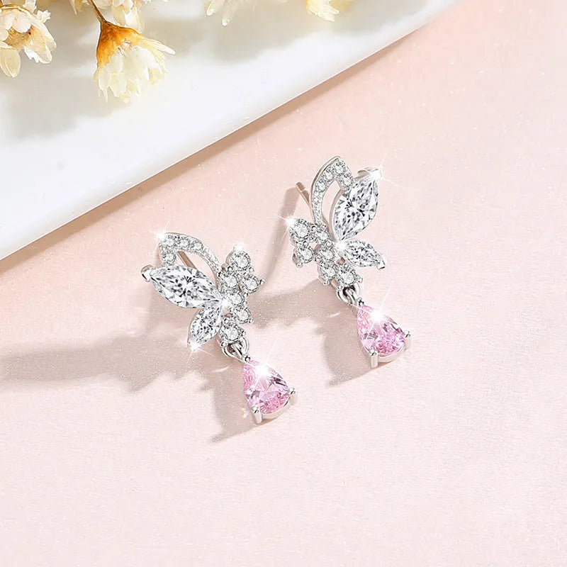 Women's sterling silver butterfly stud earrings with crystal accents on white background