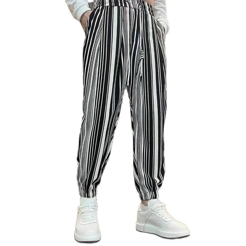Men's cropped ankle-tied ice silk pants in dark gray stripe pattern, front view on model