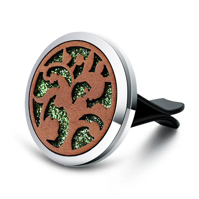 Round car vent aromatherapy clip in alloy wood construction showing hollow centre for incense