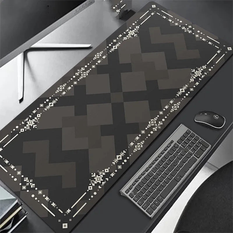 All black extra long mouse pad with precision overlock stitching on a desk