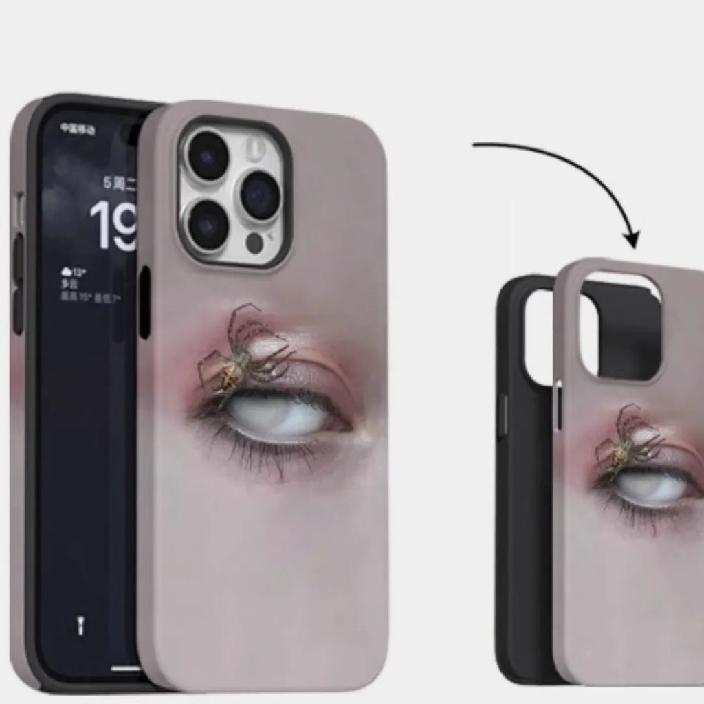 Dark frosted iPhone case with a spider web pattern, shown protecting a mobile phone.