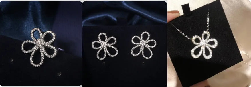 S925 sterling silver five petal jewellery set with necklace, ring, and earrings on white background