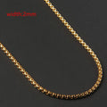 Less steel Figaro Cuban chain necklace in silver on white background showing links and clasp