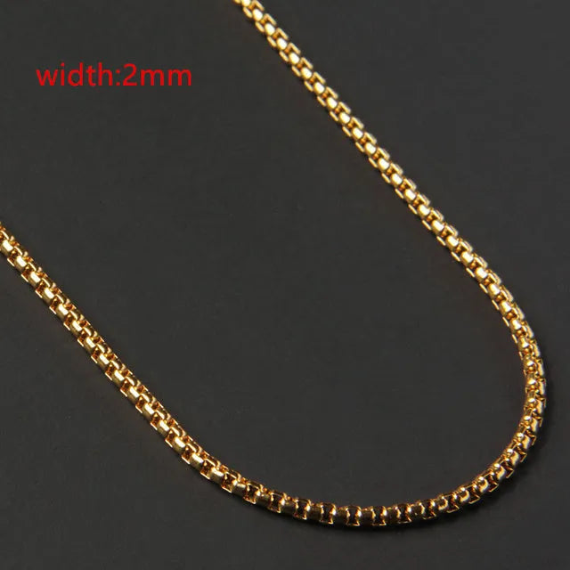 Less steel Figaro Cuban chain necklace in silver on white background showing links and clasp