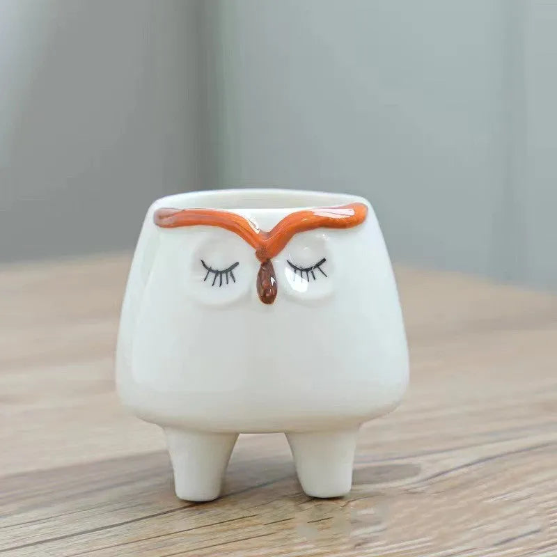 Ceramic succulent flowerpot with hand-painted cartoon animal design in pastel colours