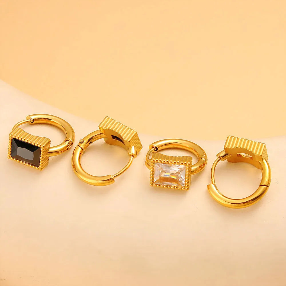 Geometric stainless steel earrings with a square zircon centre and round ring detail in black, green, or white.