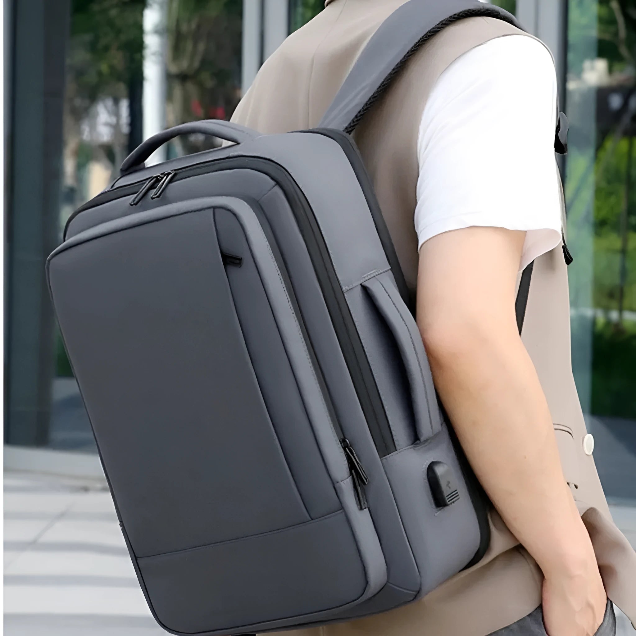 Black waterproof Oxford cloth backpack with Derm leather detailing and curved shoulder straps