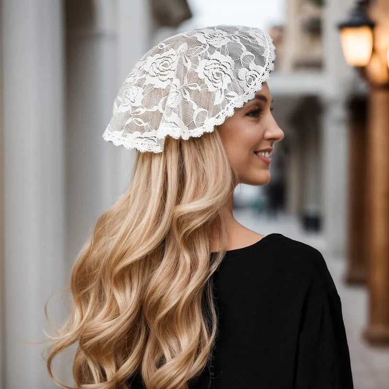 Round wedding veil head covering with floral decoration in black or white colours measuring 30cm diameter