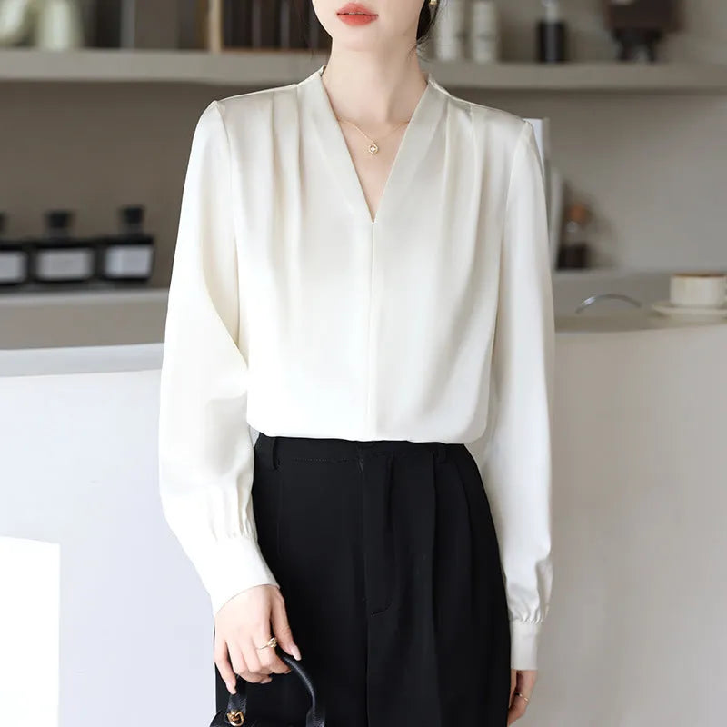 Women's blue satin shirt with long sleeves and slim fit showing 3D stitching detail