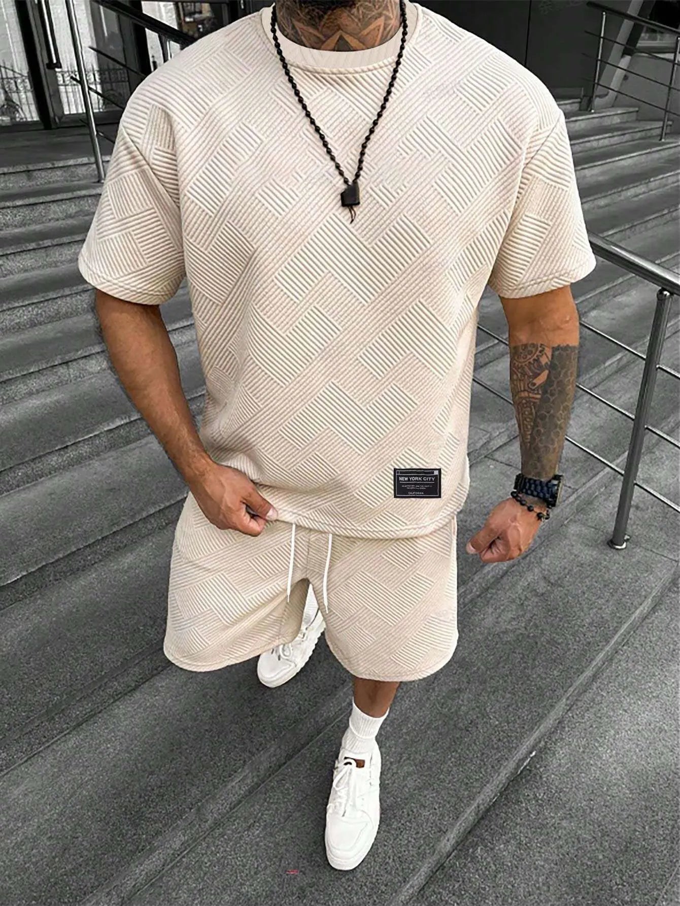 Men's short sleeve top and shorts suit with 3D printed pattern for sport and leisure wear.
