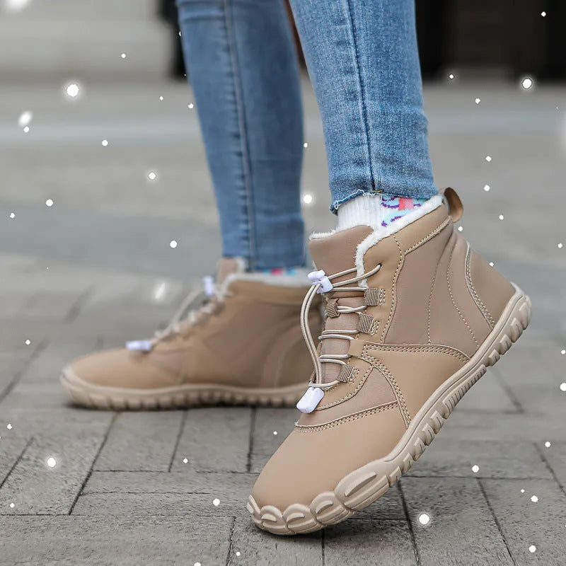 Unisex black waterproof snow boots with lace-up front, fleece lining, and rugged rubber sole on a winter background.