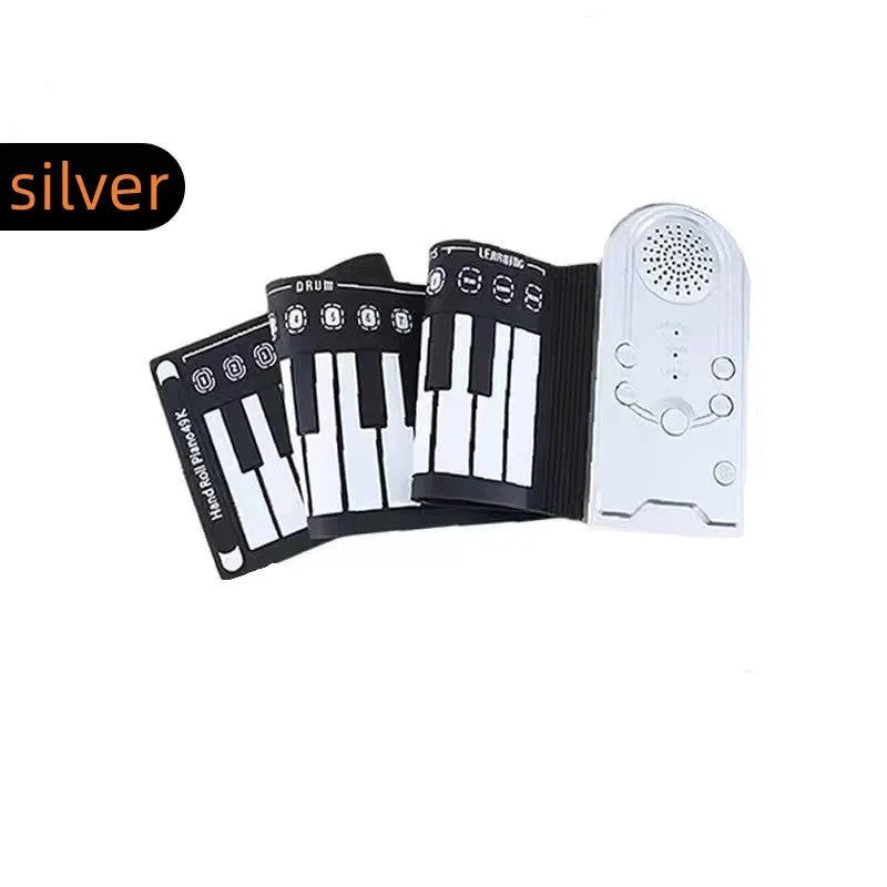 Pearl white portable electronic keyboard with rolled-out silicone keys and compact ABS plastic control panel.