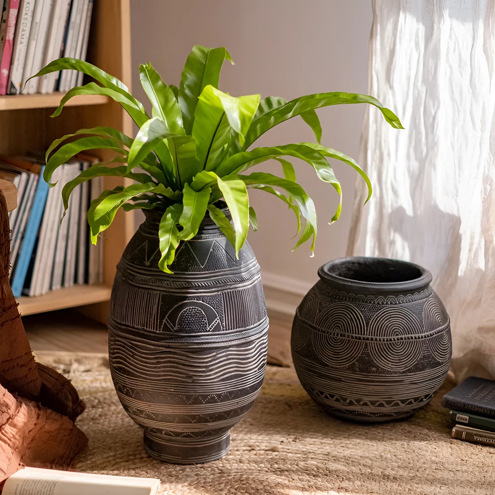 Medium cement flower pot with African ancient tank ethnic design and drainage hole.