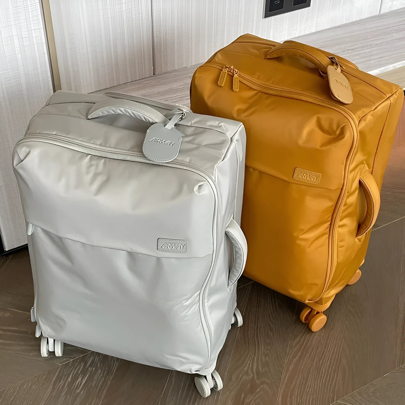 Ultra-light waterproof Oxford cloth suitcase in bluestone green with universal wheels, shown with a 24-inch size example.
