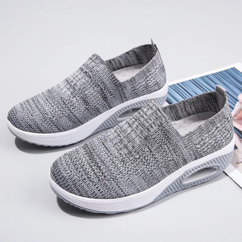 Women's mesh running shoes with air cushion sole in beige colour showing round toe and elastic lace design