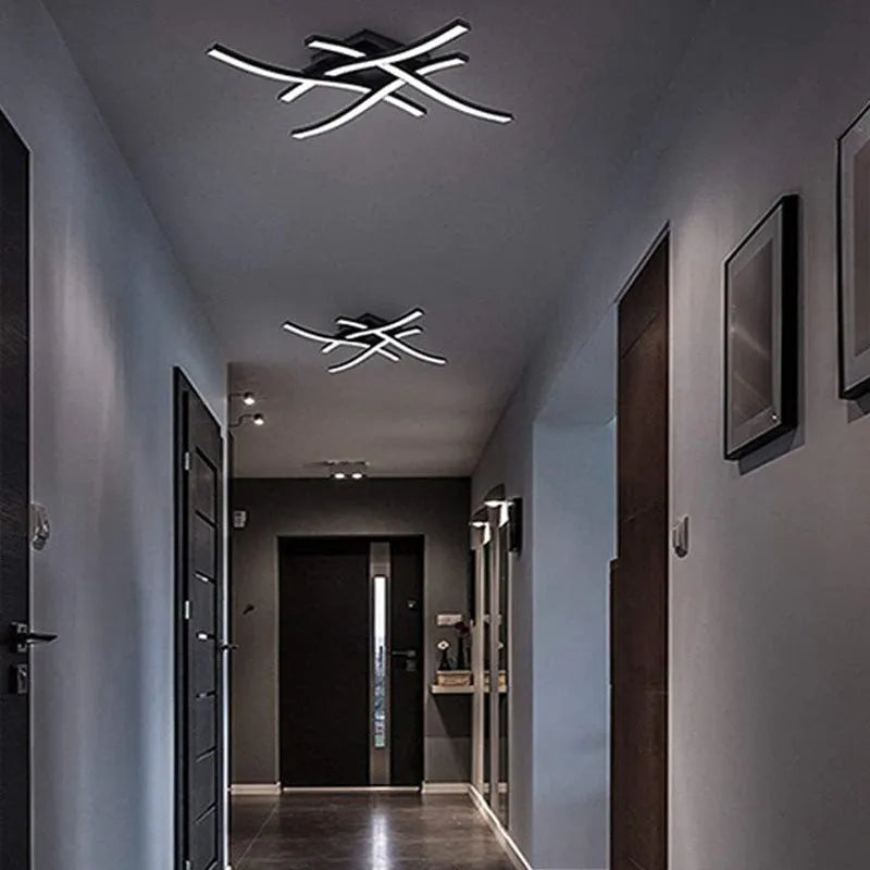Modern minimalist black flush mount LED ceiling light with aluminium shade, shown on a white ceiling.