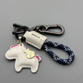 Handmade cowhide key ring pendant with a detailed zinc alloy pony buckle and coloured flannelette rope.