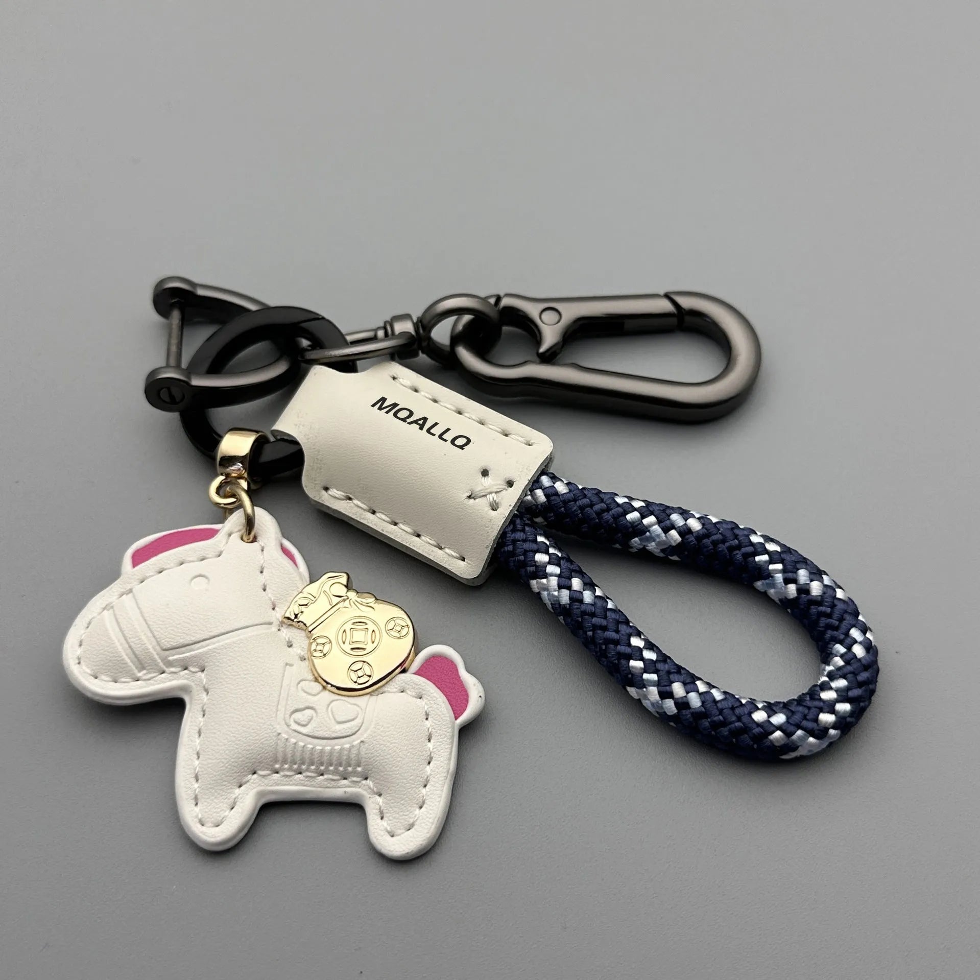 Handmade cowhide key ring pendant with a detailed zinc alloy pony buckle and coloured flannelette rope.