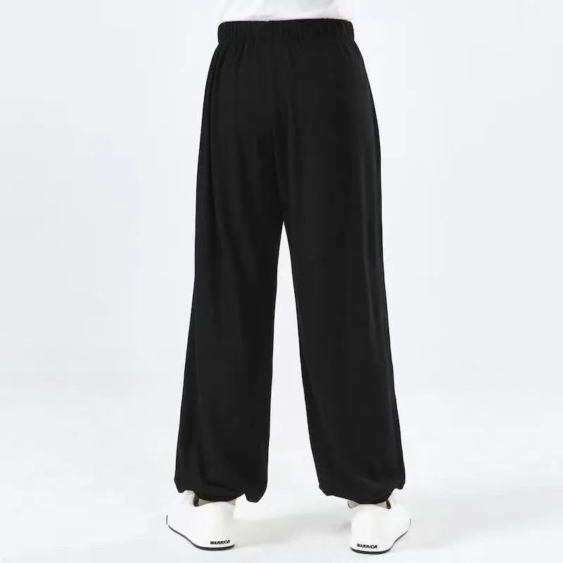 Children's black high elasticity Sanda practice pants for martial arts.