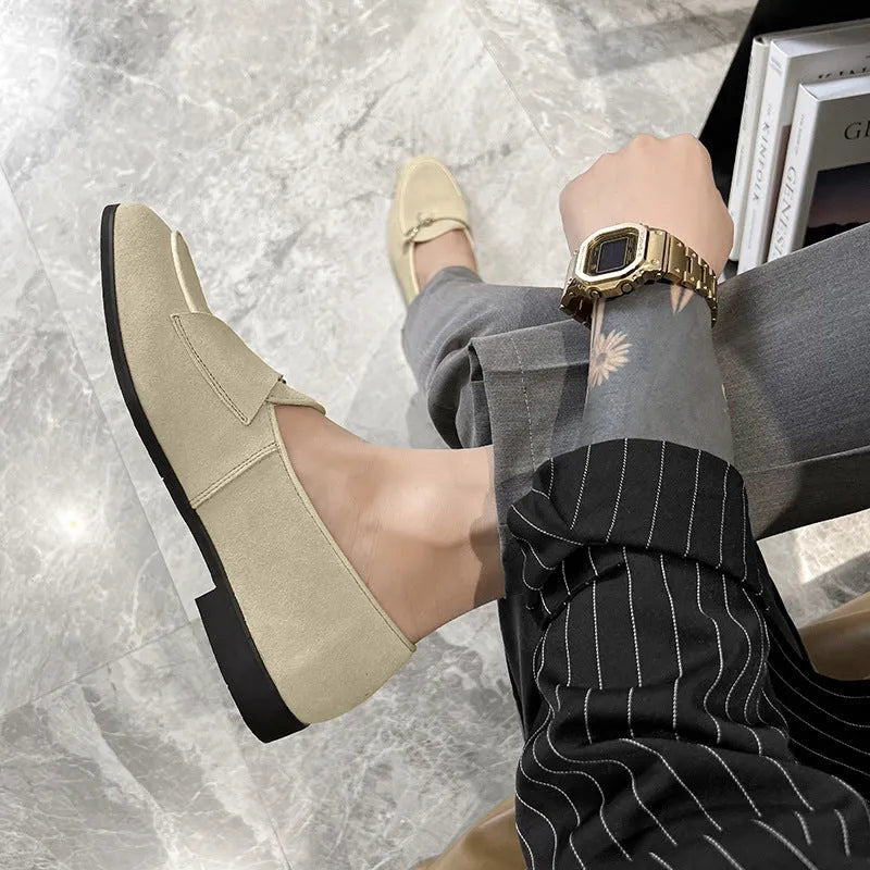Pair of men's cow split suede leather loafers with low heel and metal detail in beige