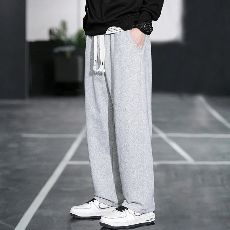 Men's grey Ninth Sports Pants showing high waist and multiple pockets.