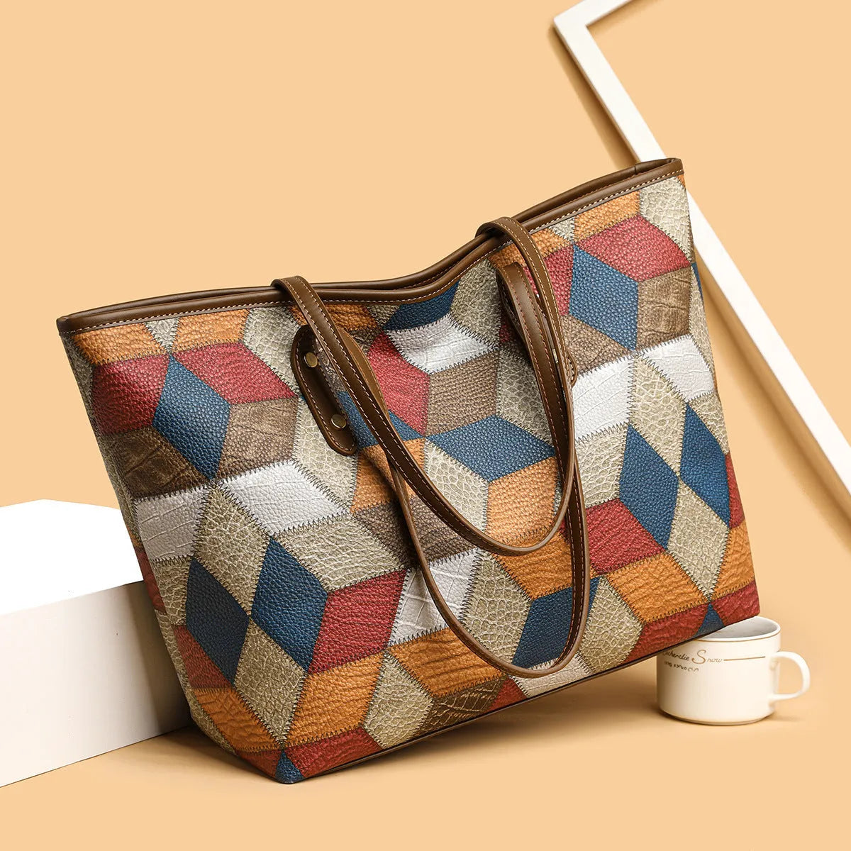 Women's PVC shoulder bag with sandwich pocket design in blue-brown colour