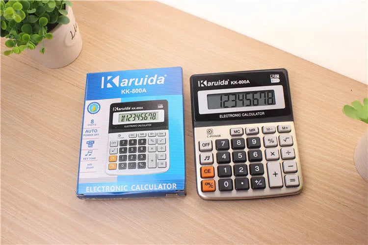 Compact aluminium desktop calculator in silver-grey finish, approximately 14.5cm long, for basic office calculations
