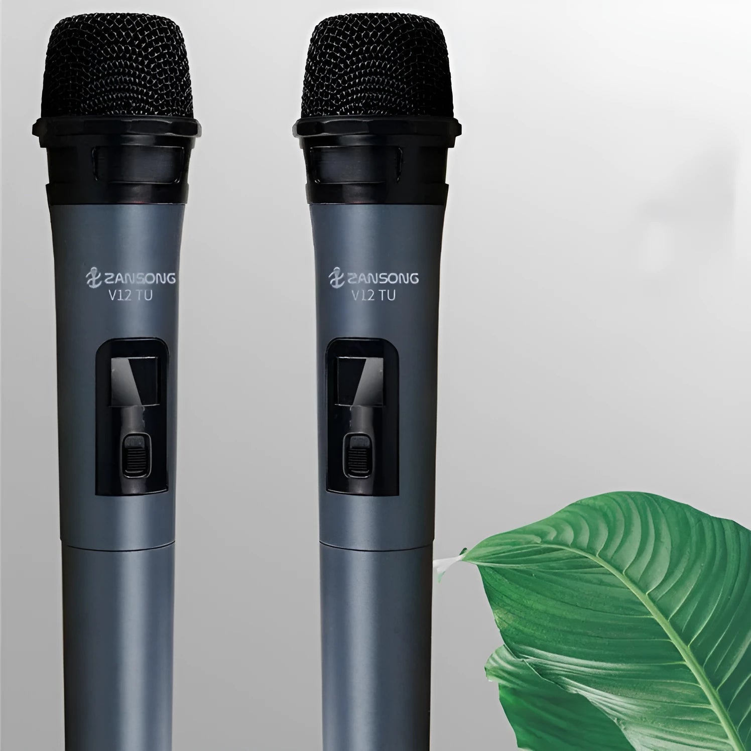 Black ZANSONG V12 wired dynamic handheld microphone with USB receiver and audio cable.