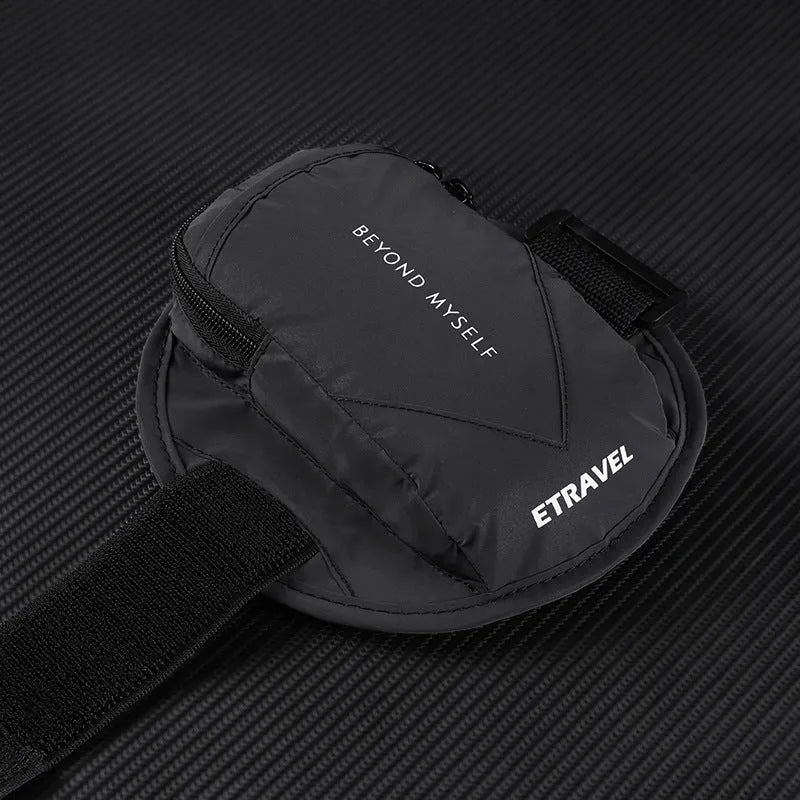 Black running arm bag with reflective strips, adjustable strap, and zip closure, shown on a person's arm.