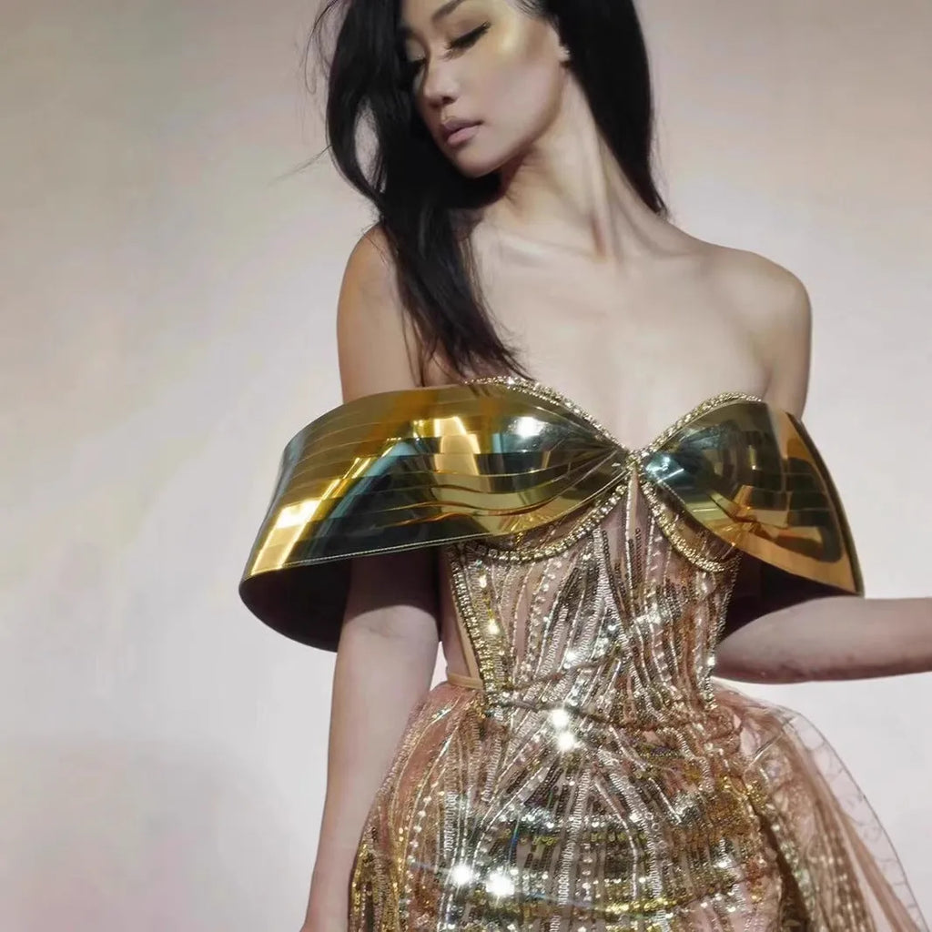 Gold strapless sequin dress with thigh-high split and tulle skirt, floor-length formal gown