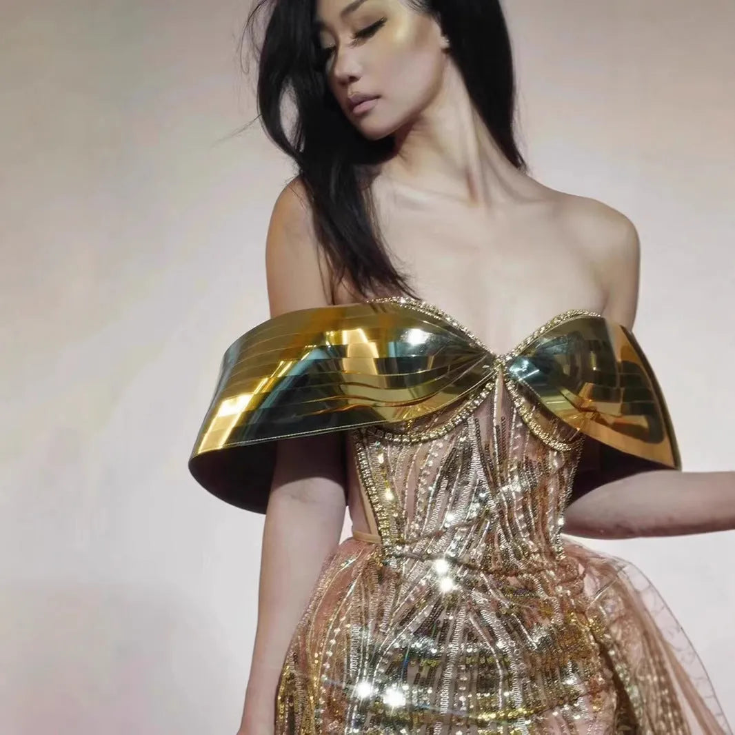 Gold strapless sequin dress with thigh-high split and tulle skirt, floor-length formal gown