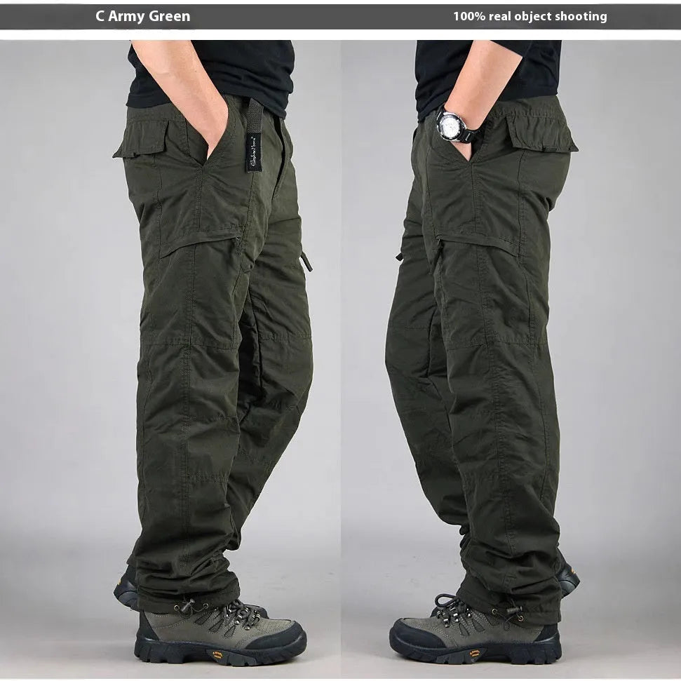 Men's wool-lined cotton velvet overalls in army green, shown in a loose straight-leg fit.