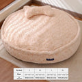 Round nest style pet bed in a milk tea colour with a removable cloth cover.