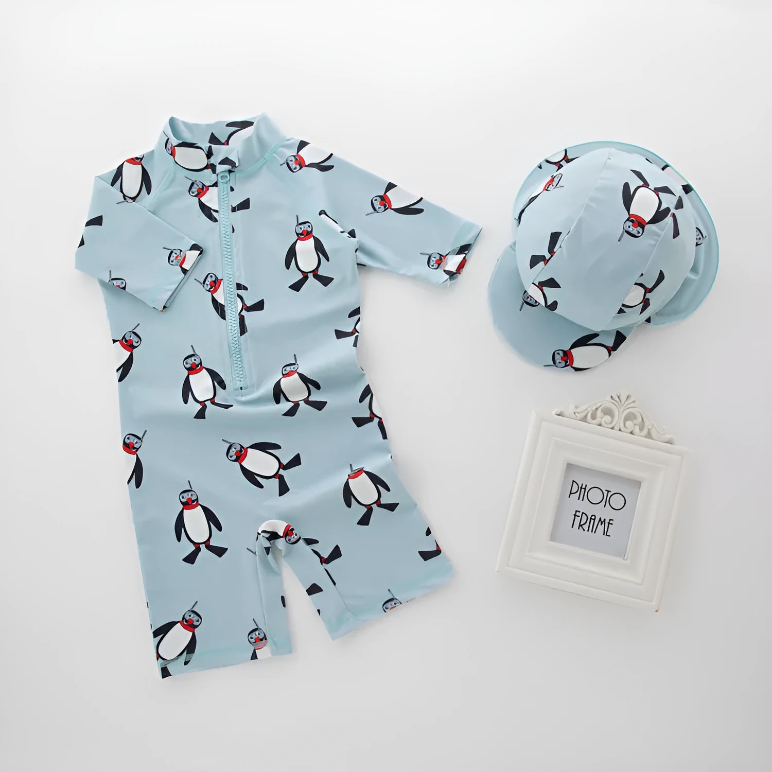 Boys' penguin print swimming costume set with long sleeves and matching swimming cap