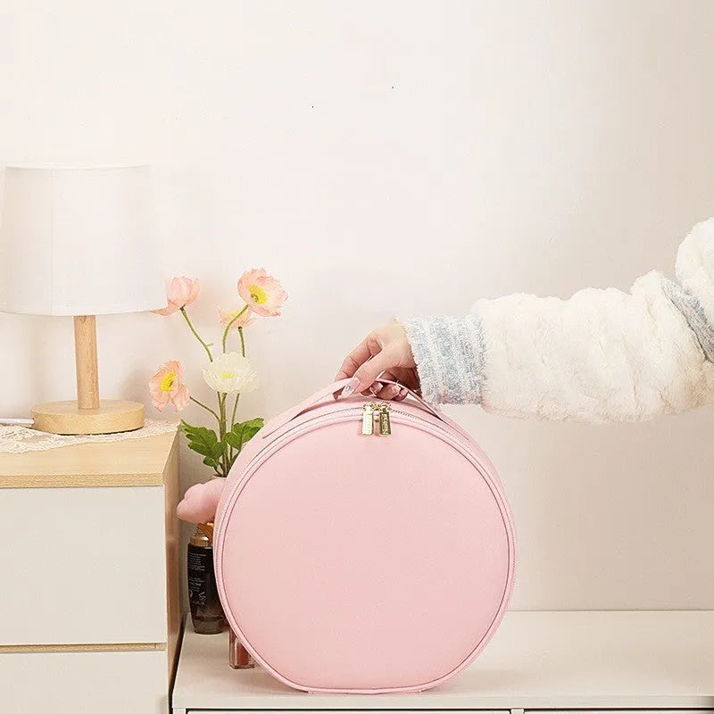 Round Cherry Blossom Pink LED makeup bag with mirror open, showing internal compartments and adjustable lights.