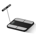 Black electronic weighing scale with colour screen on a tempered glass platform, showing body fat percentage.